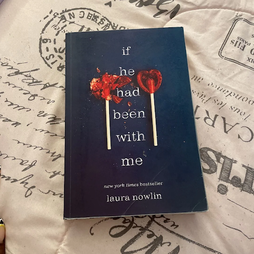 A paperback copy of “If He Had Been With Me.”

