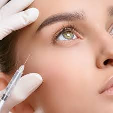 A woman receiving Botox near her eye. 